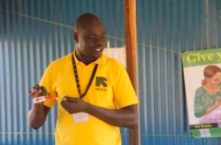 CHWs being trained on the new MUAC with dual-red zones