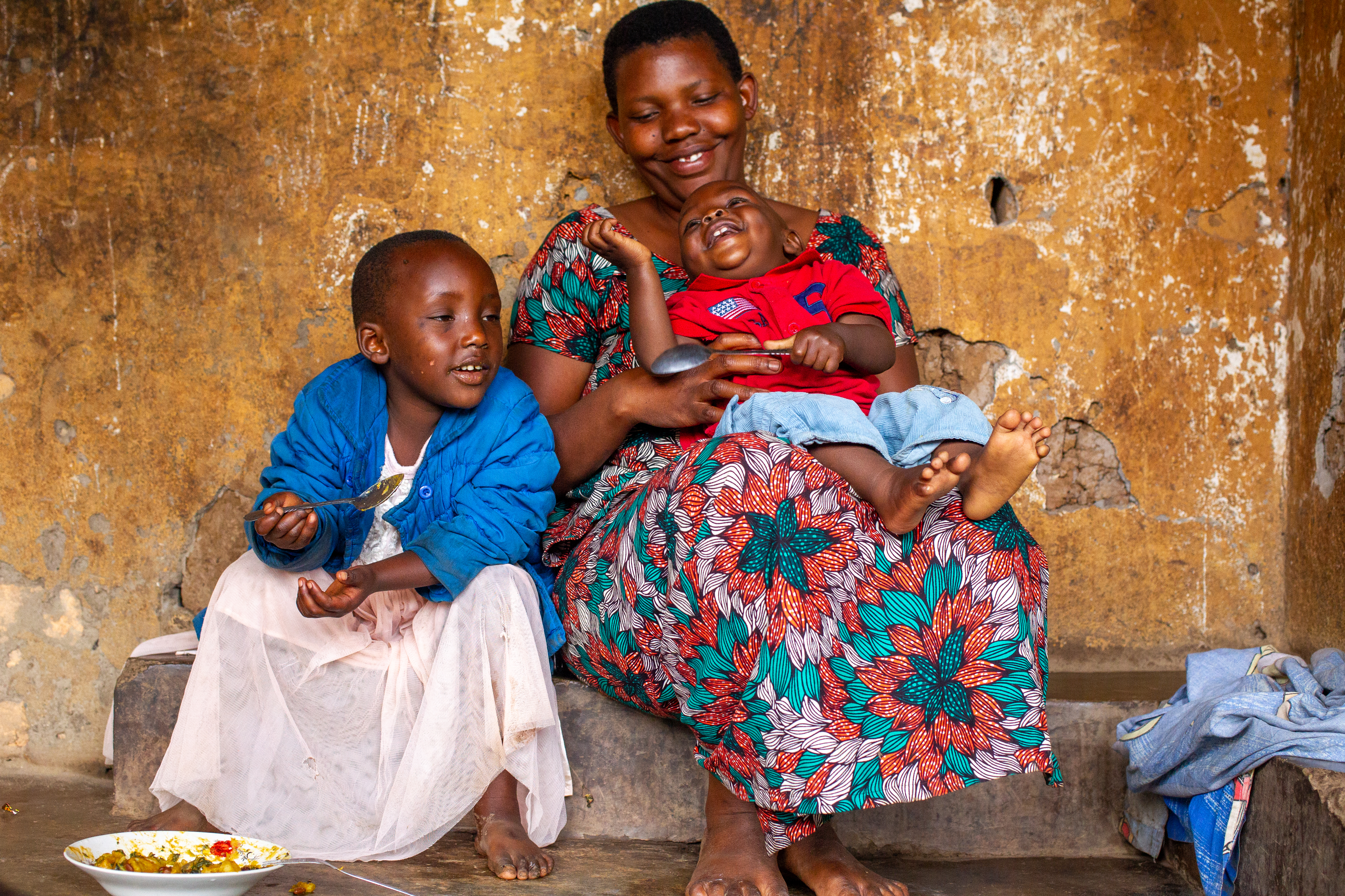 Merankebandi participant and her children. Burundi, 2021