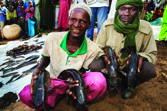 A fish pond deepened allows local communities to fish for commercial purposes in Wara Wara, Nigeria