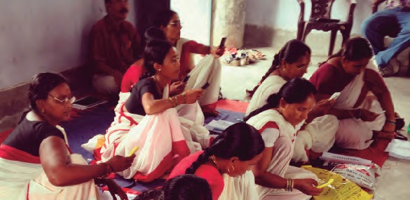 Anganwadi Workers being trained on using the customised mobile phone application for BCSP