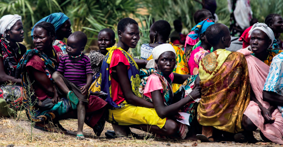 Women with young children attend a health education session on feeding and hygiene practices in Baidoa, Bay Region, Somalia, 2017