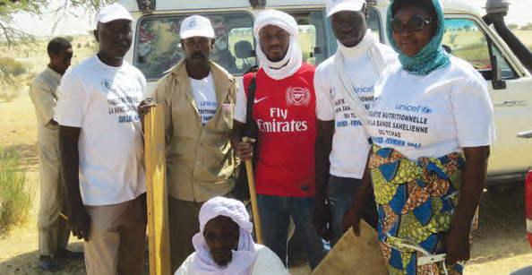 A field team with the village guide before households census, Barh El Gazal region