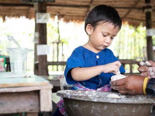 A boy preparing his lunch in Cambodia