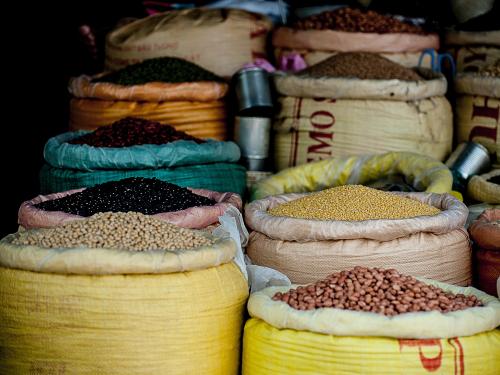 Beans and spices in sacks in a market
