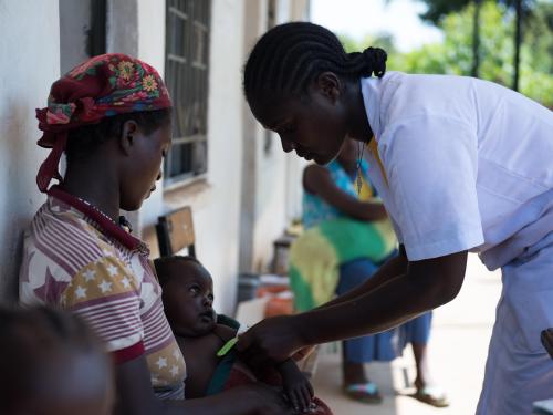 Medical professional checking a child