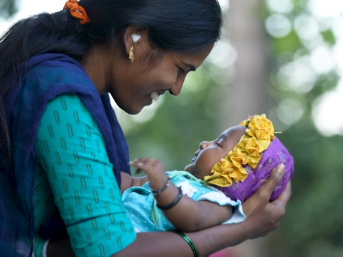 Mother holding her baby