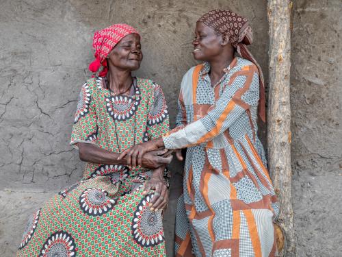 Two elderly woman smiling together