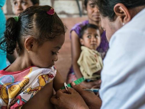 child receiving an injection