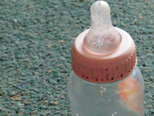 Front cover is a picture of a feeding bottle.