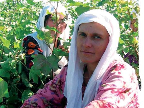 Front cover image shows two women working in a crop field