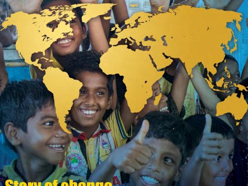 A photo of children with a world map
