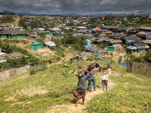 People walking through a rural village