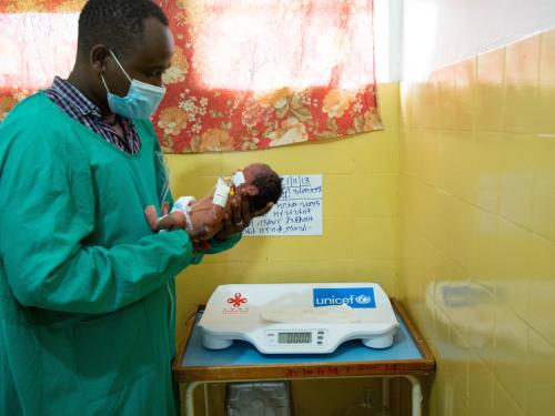 Nurse cares for a prematurely born baby inside the ethiopian neonatal intensive care unit