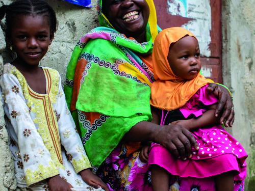 Woman smiling with two children