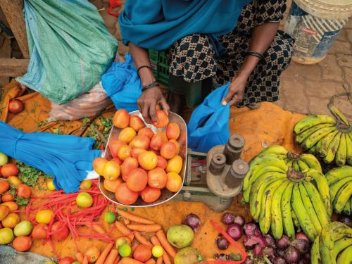 A collection of fruit and vegetables in a market stall