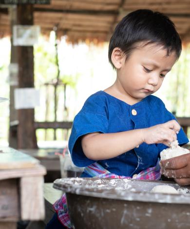 A boy preparing his lunch in Cambodia