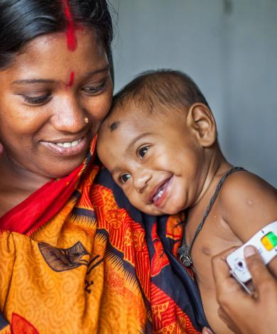 Smiling woman and baby