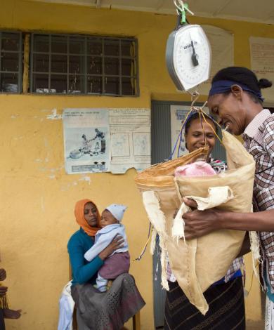 3 year old being weighed at a health post in Ethiopia 