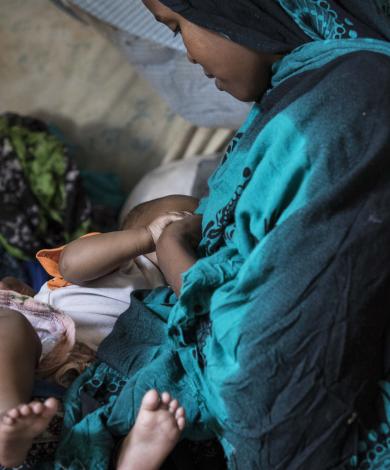 Mother breastfeeding baby