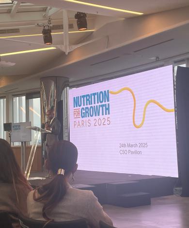 Nutrition 4 Growth Side event in progress with a speaker on the stage