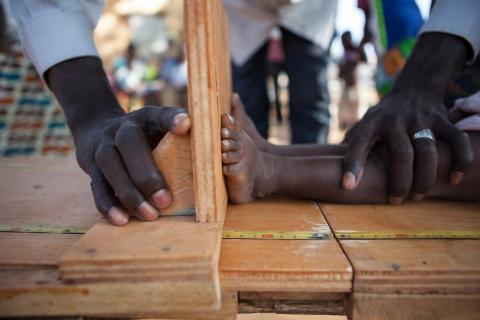 Height being measured for a stunted child