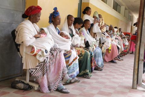 A line of women with their babies
