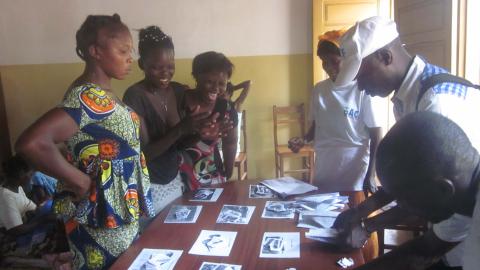 a group around a table with pictures on it