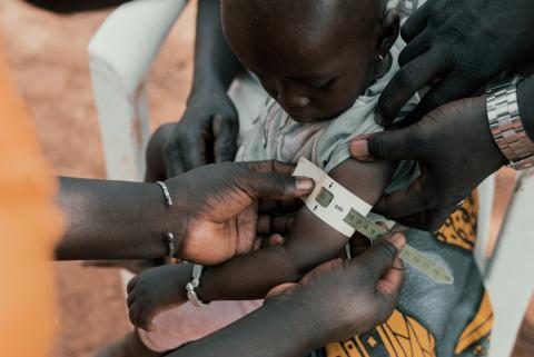 child's upper arm being measured