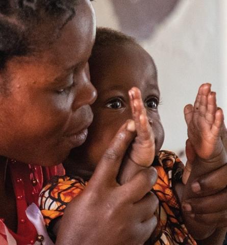 mother and child clapping