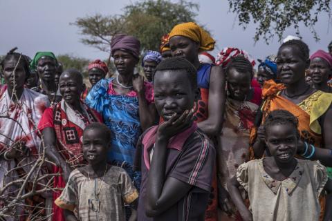 a crowd of figures standing outside