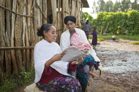 People reading and sharing magazine