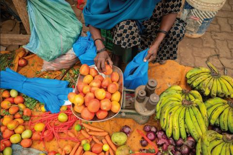 A collection of fruit and vegetables in a market stall
