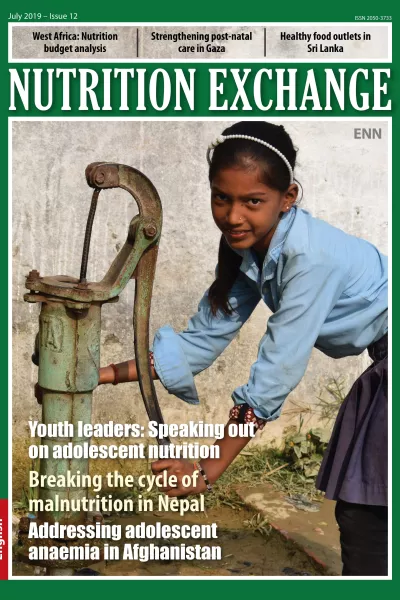 Front cover of Arabic version of Nutrition Exchange Issue 12. Image shows a school girl collecting water from a water pump.