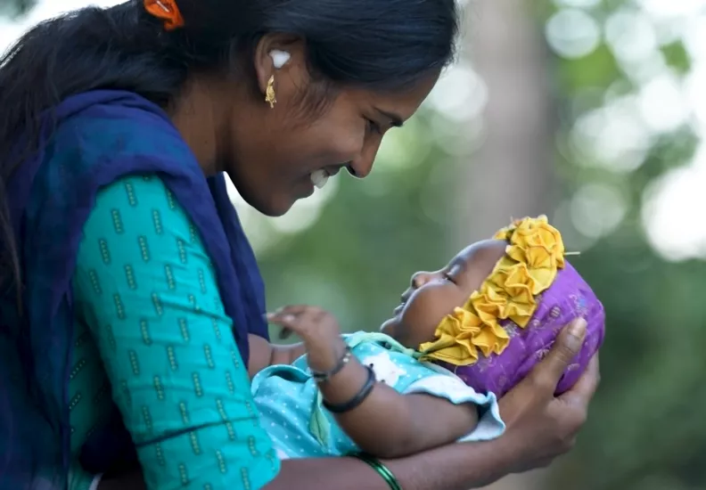 Mother holding her baby