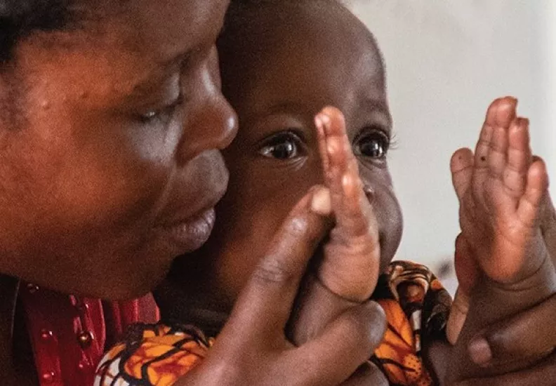 mother and child clapping